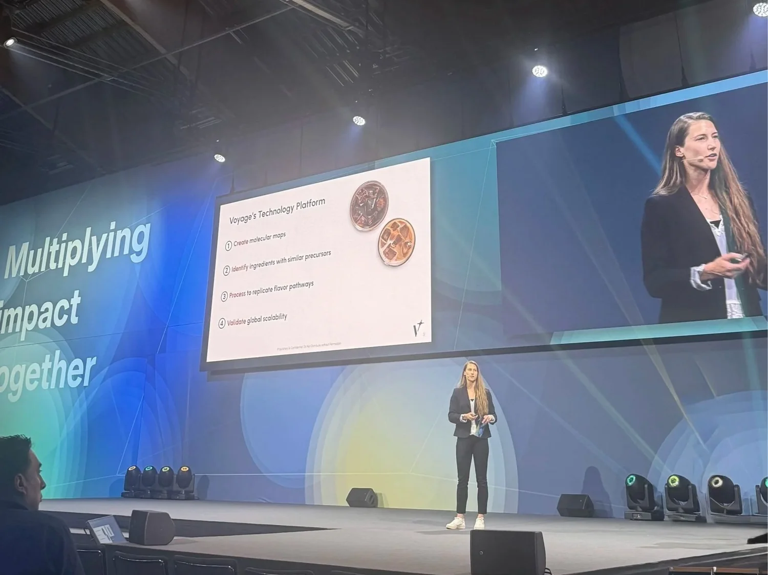 Kelsey Tenney speaking on stage about Voyage Foods' technology platform